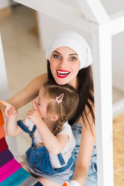 Top View Young Smiling Woman Who Keeps Her Daughter Lap — Stockfoto
