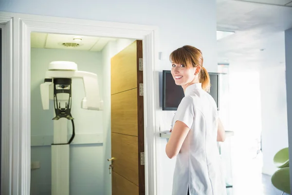Happy Smiling Doctor Assistent Stomatology Clinic Opened Door Cabinet Orthopantomograph — Stock Photo, Image