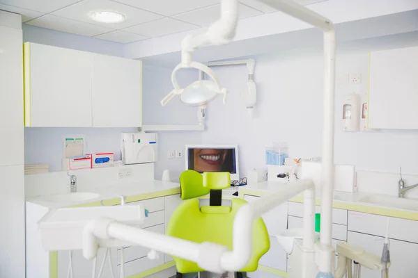 Modern dental practice. Dental chair and other equipment. Dentist workplace.