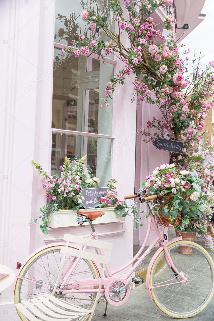 Photography of pink bicycle near restaurant with amazing interior