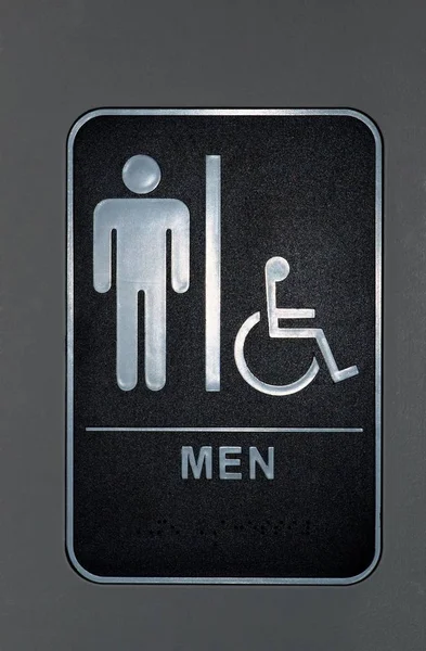 Μια Μαύρη Κάθετη Πινακίδα Στην Πόρτα Του Μπάνιου Ανδρών Που — Φωτογραφία Αρχείου