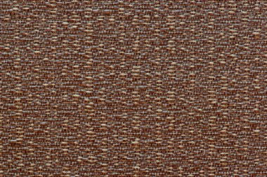 Benekli ve pürüzlü bir görünüme sahip sıkıca dokunmuş dikiş ipliklerinin bir katı renk dokulu kahverengi arka plan.