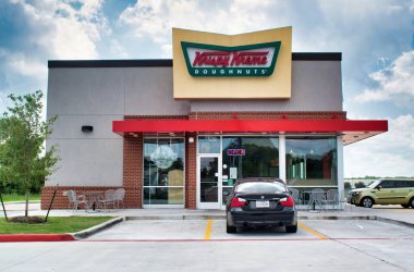 Humble, Texas/USA 09/30/2019: Krispy Kreme Doughnuts on FM 1960 Rd in Humble, TX. Established in North Carolina 1937, it has now become a famous doughnut coffee house with stores worldwide. clipart