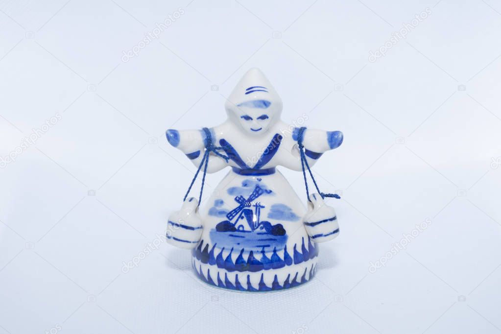 Delft Blue Figurine of girl carrying bells. Souvenier from Holla