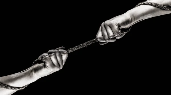 Hand holding a rope, climbing rope, strength and determination. Two hands, helping hand, arm, friendship. Rescue, help, helping gesture or hands. Conflict, tug of war. Rope, cord. Black and white — Stock Photo, Image