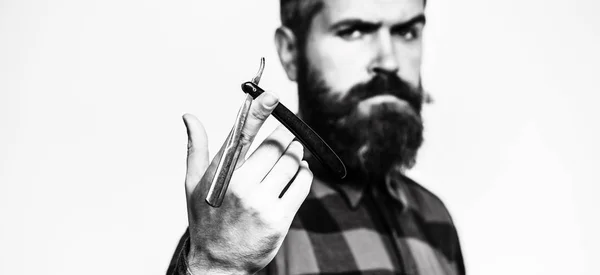 Straight razor, barbershop, beard. Barber scissors. Mens haircut. Man in barbershop. Bearded man, lush beard, handsome. Hipster, brutal male. Barber shop. Vintage straight razor. Black and white — Stock Photo, Image