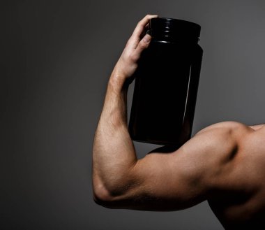 Steroid, spor vitamin, doping, anabolik, protein. Kas el, tricep. Güçlü el, adam kol, yumruk. Kas kol. Kasları güçlü. Sporcu, tricep kasların, sporcu adam