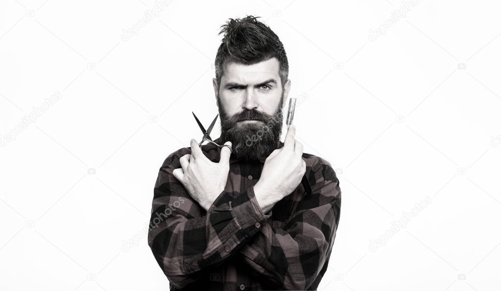 Portrait of stylish man beard. Barber scissors and straight razor, barber shop. Bearded man, bearded male. Vintage barbershop, shaving. Black and white