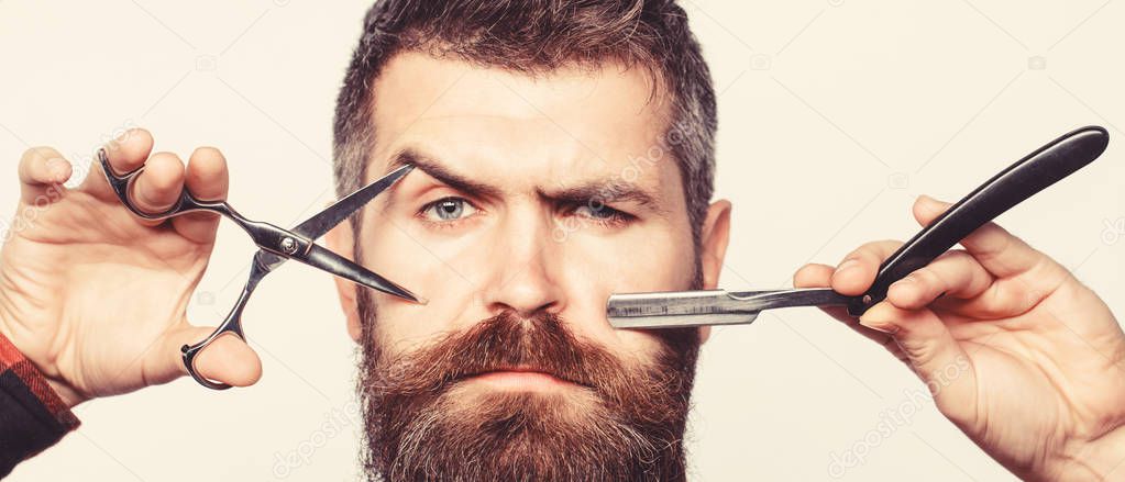 Bearded man, bearded male. Portrait of stylish man beard. Barber scissors and straight razor, barber shop. Vintage barbershop, shaving