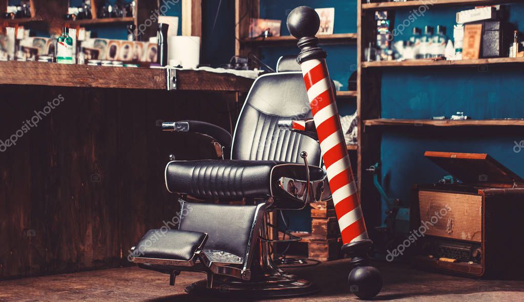 Barber shop pole. Logo of the barbershop, symbol. Stylish vintage barber chair. Hairstylist in barbershop interior. Barber shop chair. Barbershop armchair, hairdresser, hair salon, barber shop for men