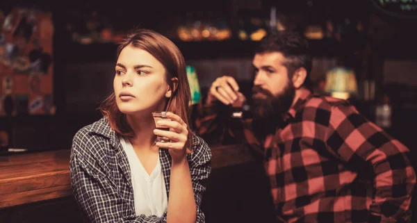 Woman alcoholic beverage in bar. Female male alcoholism. Woman and man alcoholism. Alcoholism, alcohol addiction, male alcoholic. Young man drinking alcohol. Young woman has problems with alcohol