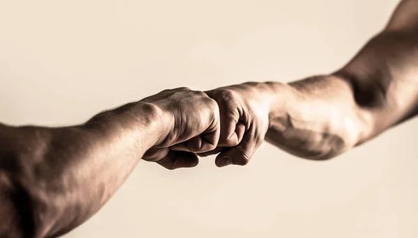 People bumping their fists together, arms. Friendly handshake, friends greeting. Man giving fist bump. Hands of man people fist bump team teamwork, success. Team concept — Stock Photo, Image