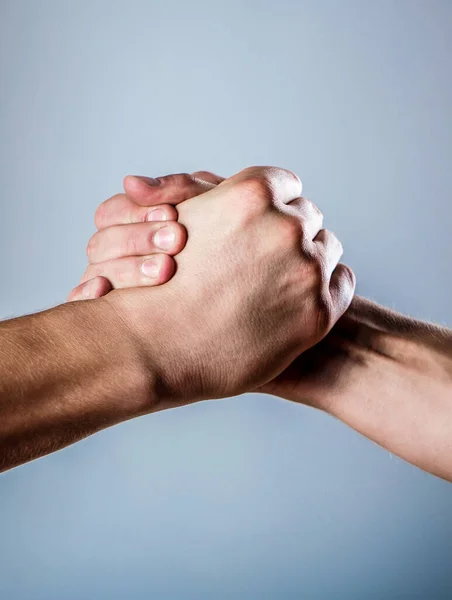 Handshake, arms. Friendly handshake, friends greeting. Male hand united in handshake. Two hands, isolated arm, helping hand of a friend — Stock Photo, Image