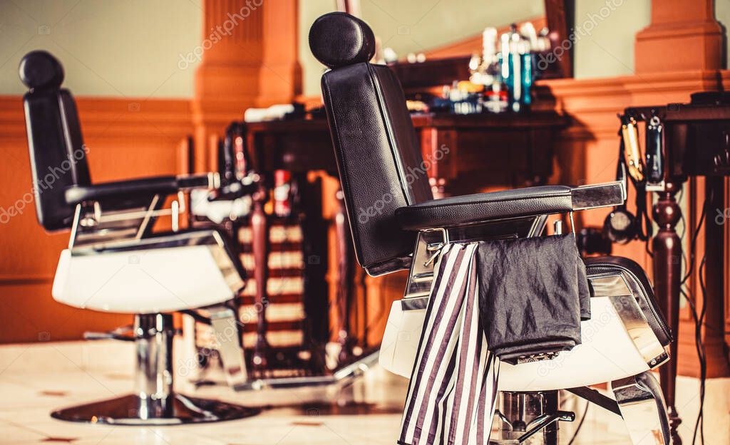 Barber shop chair. Barbershop armchair, modern hairdresser and hair salon, barber shop for men. Beard, bearded man. Stylish vintage barber chair.