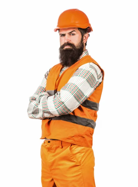 Mannen bouwers, industrie. Werknemer in de bouw uniform. Architectenbouwer. Een man met een baard in een helm of hoed. Bouwer met harde hoed, voorman of reparateur in de helm — Stockfoto