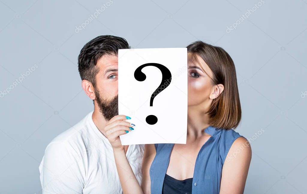 Anonymous, man and woman question. Kiss couple, incognita. Problems and solutions. Couple in quarrel. Quarrel between people. Problem in couple, question mark. Couple holding paper question mark.