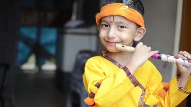 Little Lord Krishna Kanhaiya Child Playing Flute Looking Camera Indian — Stock Video