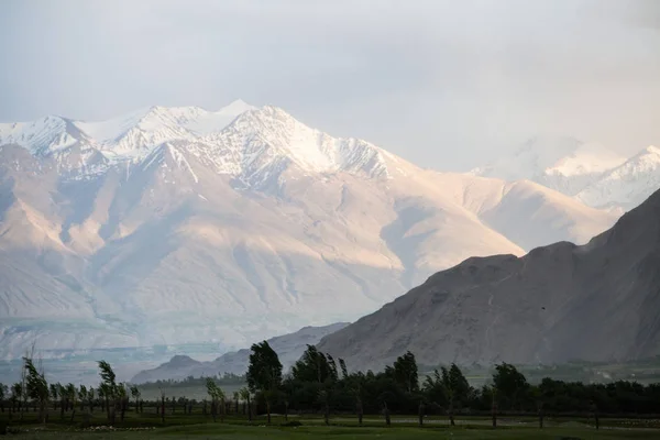 View of a snowy mountain range in Tajikistan.