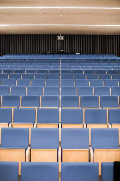 Empty blue seats in a conference room — Stock Photo, Image