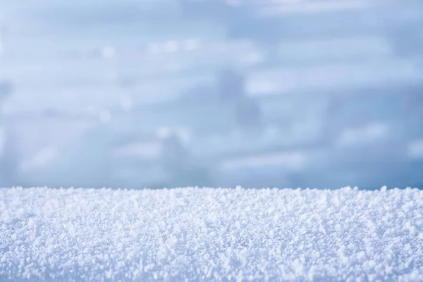 Winter achtergrond met sneeuw en wazig bokeh — Stockfoto
