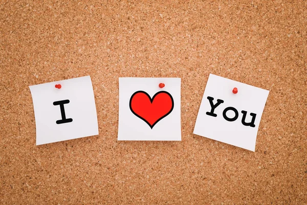 Heart and stickers on cork board. I love you. — Zdjęcie stockowe
