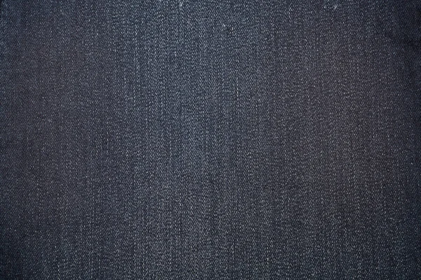 Mörk blå konsistens av denim eller Blå jeans bakgrund. — Stockfoto