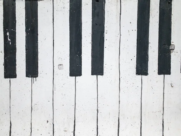 Música fundo piano chave em uma parede de tijolo — Fotografia de Stock