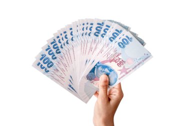 Türk parasını tutan insan eli. Beyaz arka planda yalıtılmış.