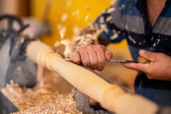 Carpenter working on wood to carving and shaping — Stock Photo, Image