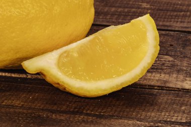 yellow, fresh lemon. lemon slices on wooden background