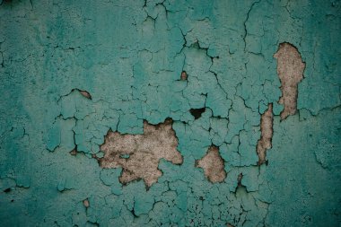 Eski grunge yıpranmış ufalanmış soyulmuş soyma yeşil boyalı sıvalı ev duvar yüzeydetay arka plan olarak yakın.