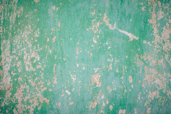 Пофарбована зелена стіна тріснула фарбою. Текстура старої стіни — стокове фото