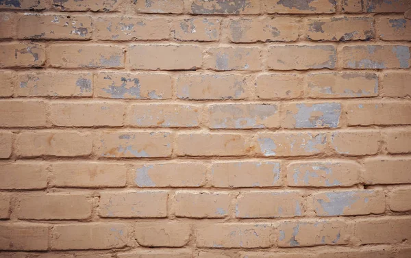 Old orange brick wall a bit showered — Stock Photo, Image