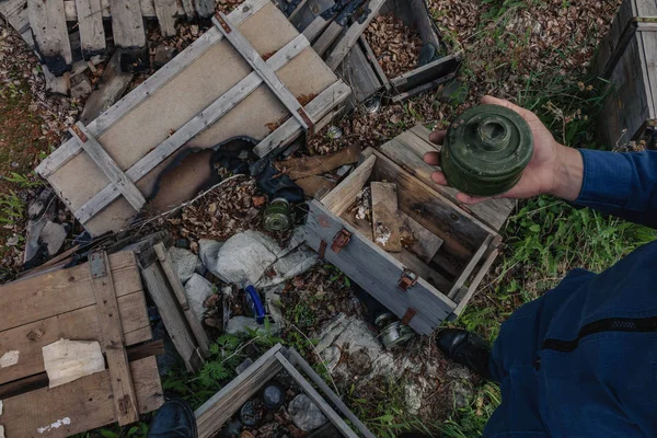 Garbage and human waste in nature. Torn gas mask in the grass in the fallen leaves in the autumn forest.