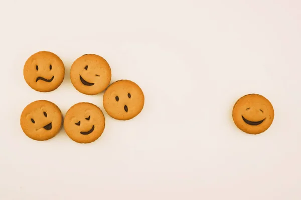 tasty cookies with different emotions on an isolated background