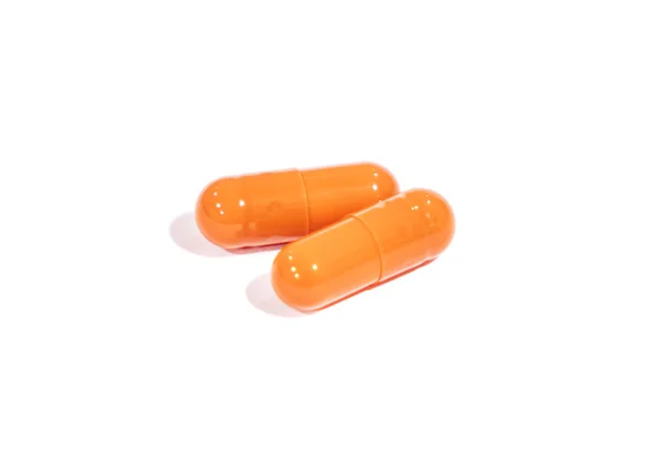 Tablets orange, isolated on a white background. medicine. — Stock Photo, Image