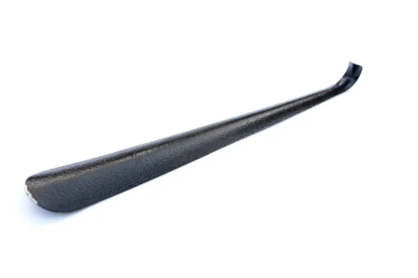 Metallo scarpa cucchiaio nero su sfondo bianco — Foto Stock