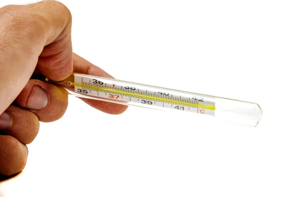Thermometer in menselijke hand geïsoleerd op witte achtergrond — Stockfoto