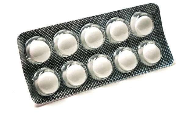 White tablets in a package isolated on a white background — Stock Photo, Image