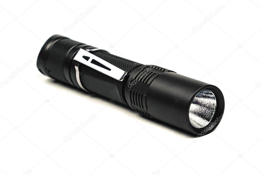 black long flashlight isolated on white background.