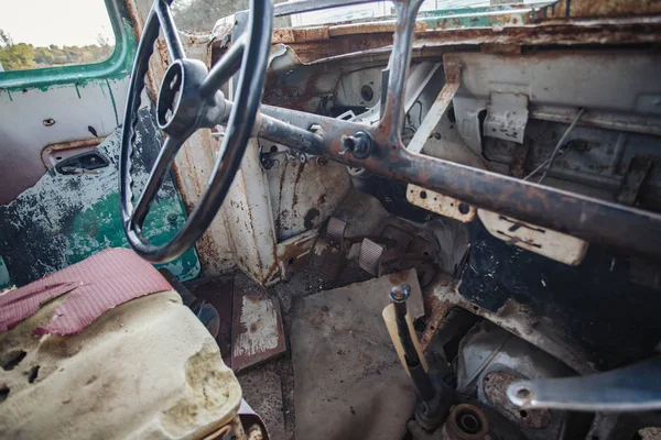 Horizontal image of the inside of the front of a very old broken down bus — Stock Photo, Image