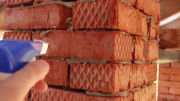 Water drops on the bricks evaporate after being hit — Stock Video