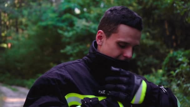 Fireman takes off his uniform — Stock Video