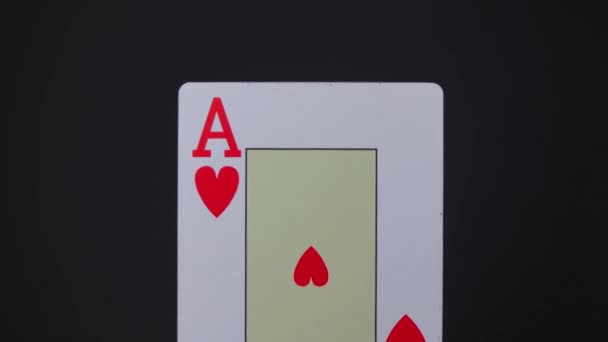ACE of hearts is approaching on a black background — Stock Video