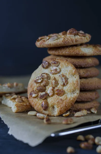 Homemade Ruddy Cookies Nuts Lie Pyramid Baking Paper Dark Blue — Stock Photo, Image