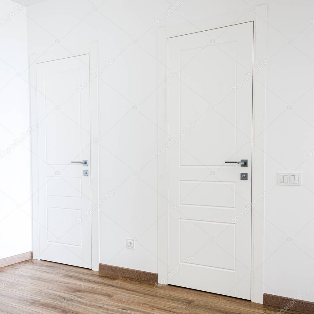 White doors and white walls in the new apartment in the Scandinavian style