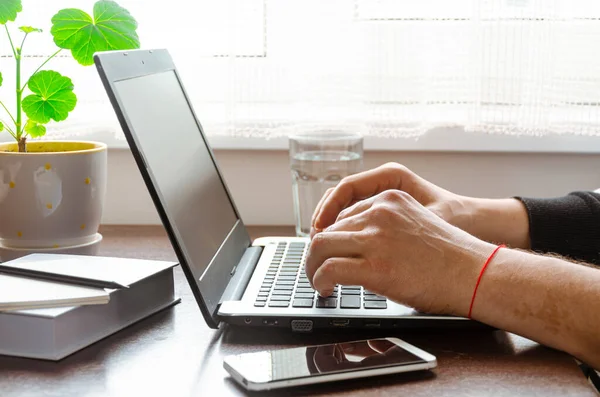 Work in self-isolation during the coronavirus pandemic. Freelancer works in the home office