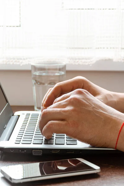 Work in self-isolation during the coronavirus pandemic. Freelancer works in the home office