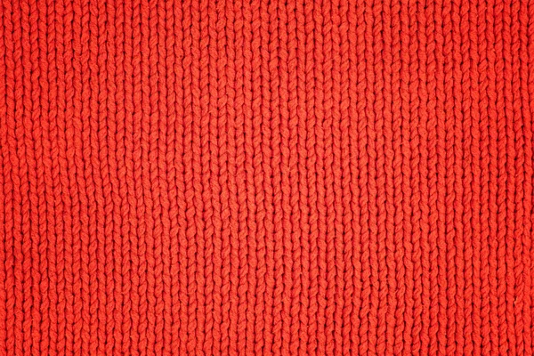 Red knitted woolen fabric as texture. Textile background — Stock Photo, Image