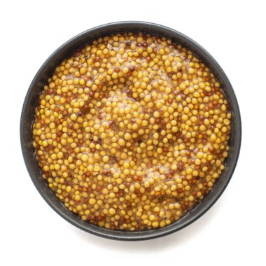 Beyaz arka plan üzerinde izole koyu kase grenli hardal. Üstte görüntü